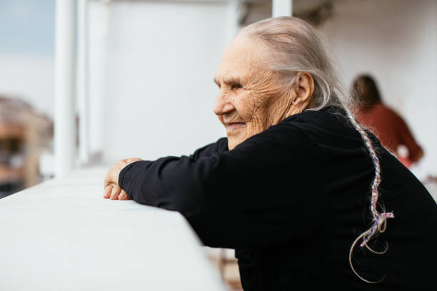 istock Happy senior woman looking away 1312502200