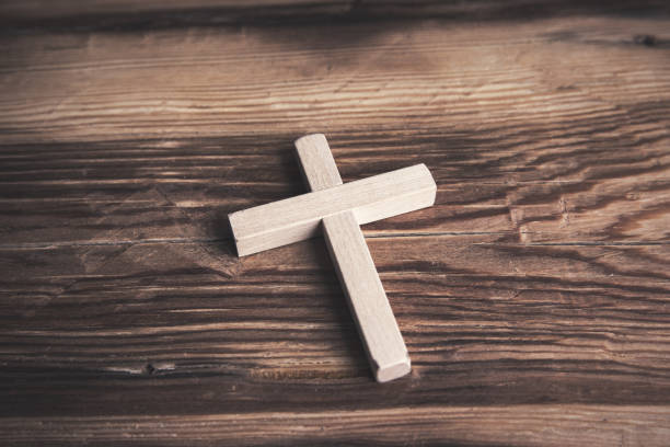 istock wooden cross on the table 1312504021