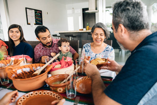 istock Multi-generation family eating together outdoors 1312506024