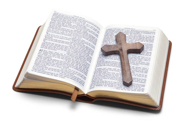 istock Open Bible with Wood Cross 1312507063