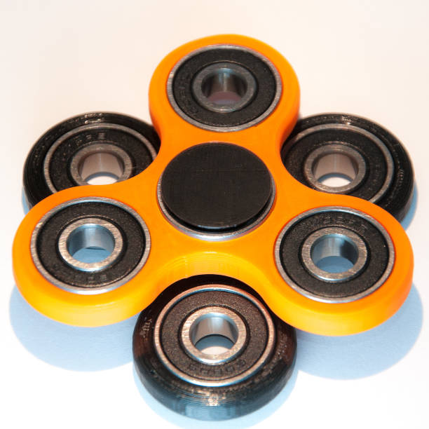 istock Fidget spinner to relax, relieve stress, play 1312508823