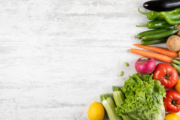 istock Fresh and Raw Vegetables on Wooden Kitchen Table 1312508970