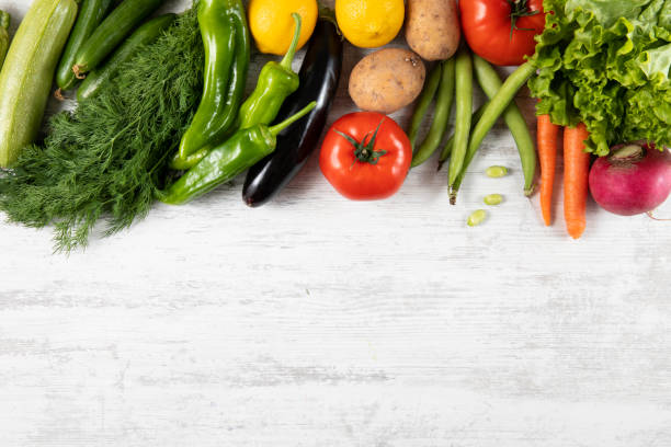 istock Fresh and Raw Vegetables on Wooden Kitchen Table 1312509009
