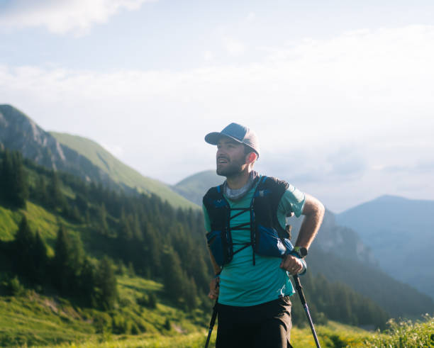 istock Trail runner ascends mountain meadow in mist 1312509566