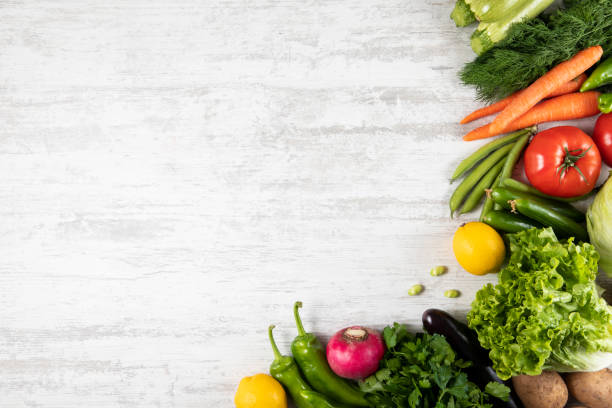 istock Fresh and Raw Vegetables on Wooden Kitchen Table 1312509608