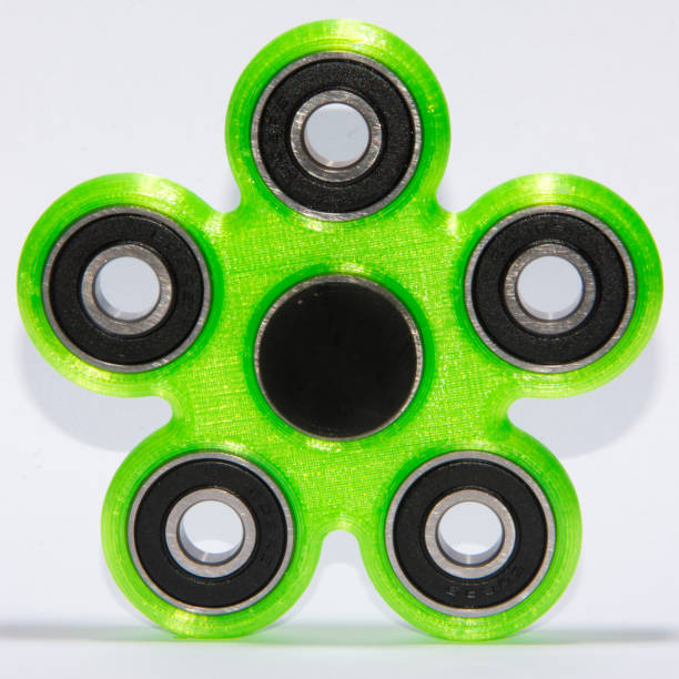 istock Fidget spinner to relax, relieve stress, play 1312509736