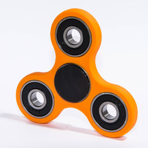istock Fidget spinner to relax, relieve stress, play 1312509857
