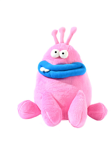 Children toy pink monster isolated on white background