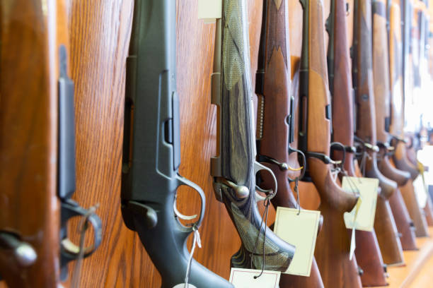 istock Gun store interior with rifles on showcase 1312512428
