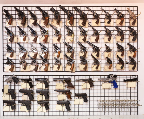 istock Gun shop interior with handguns displayed on rack 1312512431