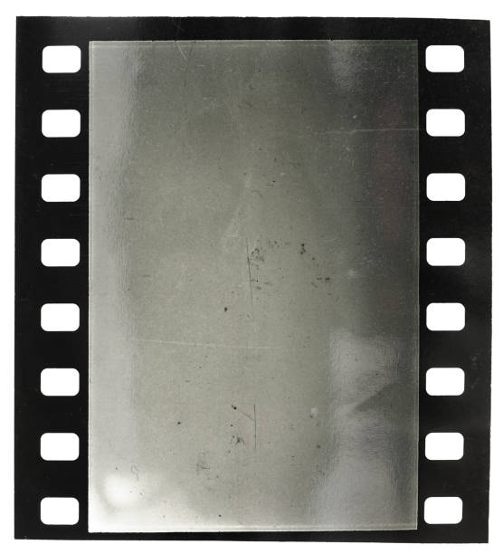 single 35mm film snip with blank or empty frame on white background and cool light reflection. retro photo placeholder. 16mm film motion picture camera photos stock pictures, royalty-free photos & images