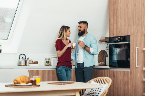 istock Couple drinking coffee in the kitchen 1312513182