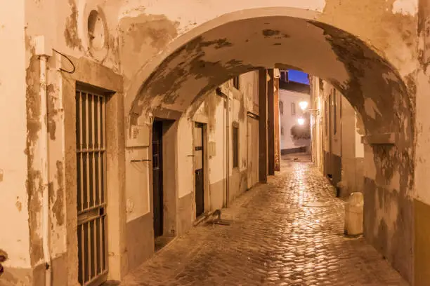 Evening view of a street in the Old Town Cidade Velha of Faro, Portugal.
