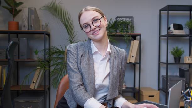 istock Young business woman freelancer concentrated developing new project while looking at camera 1312524408
