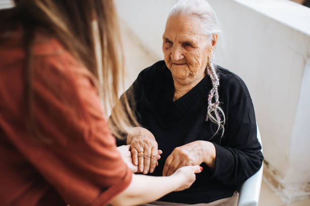istock Different generations women talking holding hands giving psychological support 1312524828
