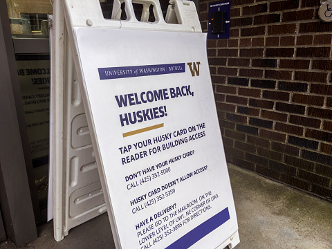 Bothell, WA USA - circa April 2021: Angled view of a Welcome Back sign at the University of Washington, welcoming students starting a new semester on campus.