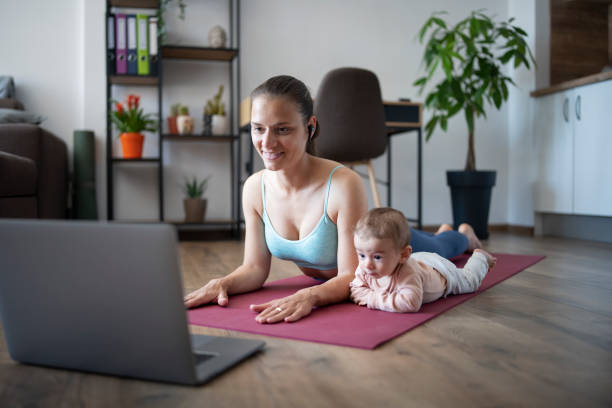 istock Single mother practicing yoga with her baby boy. 1312528321
