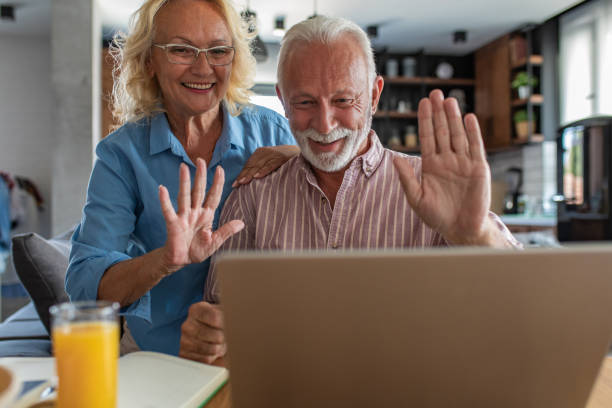 istock Happy senior couple talking on a video call at home 1312528556
