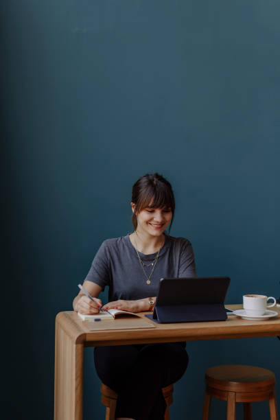 istock Young Woman Working and Smiling (Copy Space) 1312529803