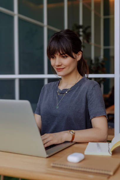 istock Beautiful Woman Typing on her Laptop and Working 1312529828