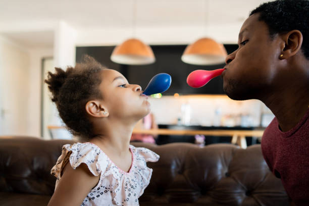 istock Daughter and father playing together at home. 1312532078