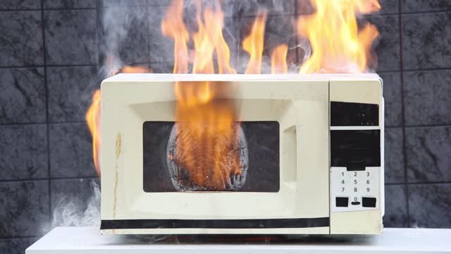 Microwave oven caught fire and caused  domestic fire.