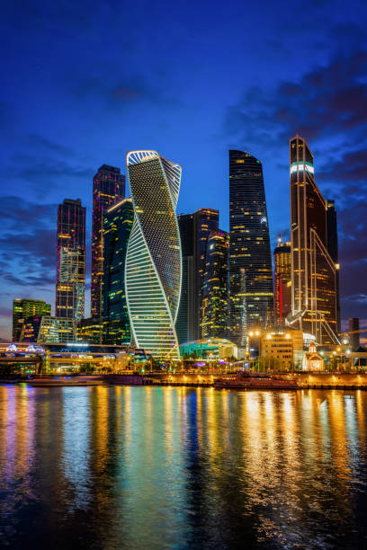 City. Night. Reflection in the water of skyscrapers, bright vivid glowing high buildings, modern lighting. City. Night. Reflection in the water of skyscrapers, bright vivid glowing high buildings, modern lighting led backlight. Modern background moscow city stock pictures, royalty-free photos & images