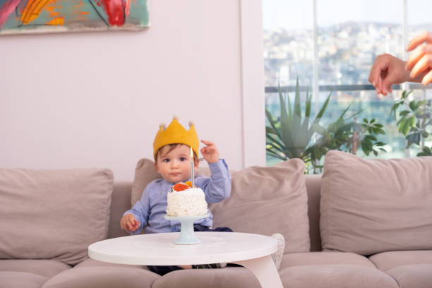 istock One Year Old boy celebrating brithday 1312536037