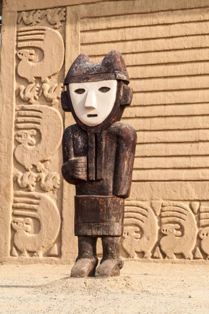 Wooden statue at archeological site Chan Chan in Trujillo, Peru