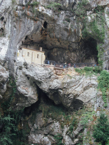 istock Vertical low angle shot of people visiting a cage in the mountains 1312538464