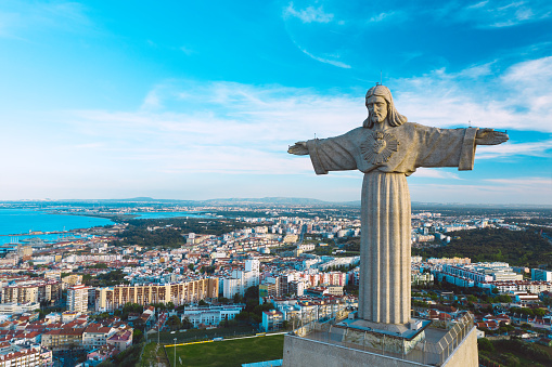 Aerial view of Sanctuary of Christ the King or Santuario de Cristo Rei on sunny summer day. Christ Statue in Lisbon, Portugal