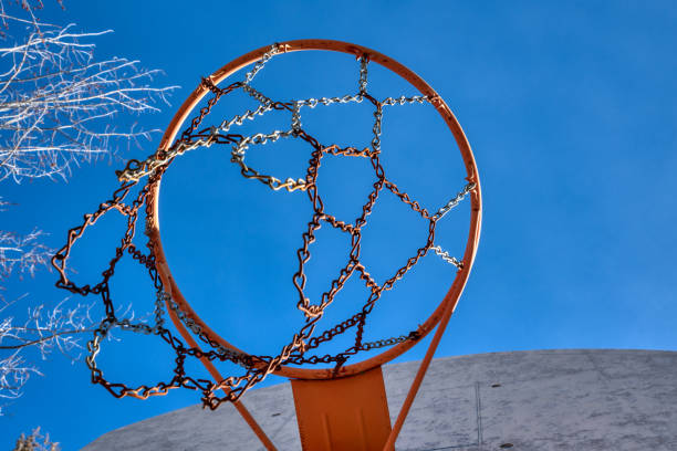 istock basketball hoop with blue sky 1312539548