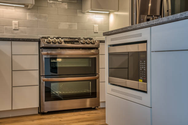 istock Modern kitchen with oven and gray cabinets 1312539549