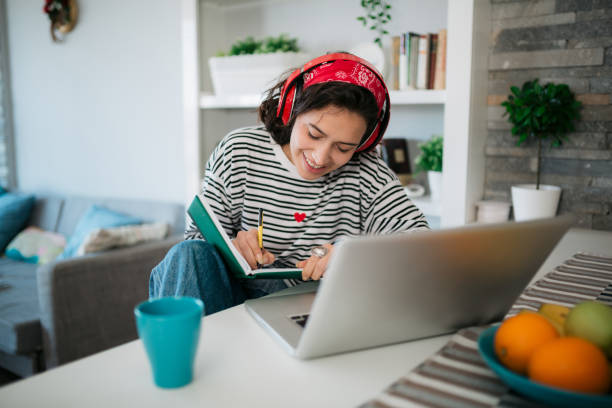 istock Young Caucasian female freelancer working from home using a laptop 1312543820