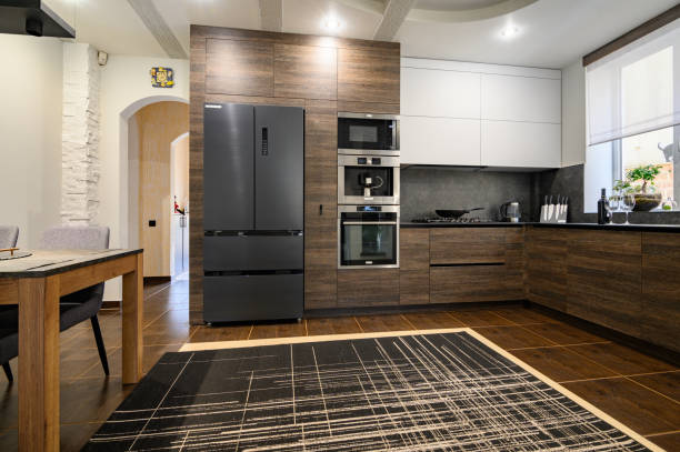 istock Modern luxurious dark brown, gray and black kitchen details 1312545490