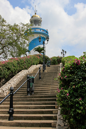 Blue and White Lighthouse or El Faro at the top of steep stairs Against Blue Sky in Guayaquil, Ecuador, South America