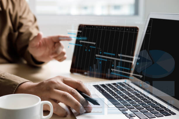 istock Businessman working project and update Gantt Software Chart scheduling virtual diagram and progress planning quality and communication gantt on virtual screen 1312549488