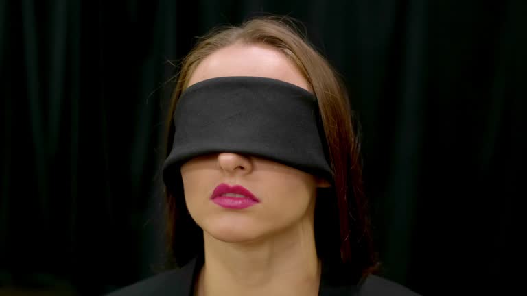 Blindfolded women