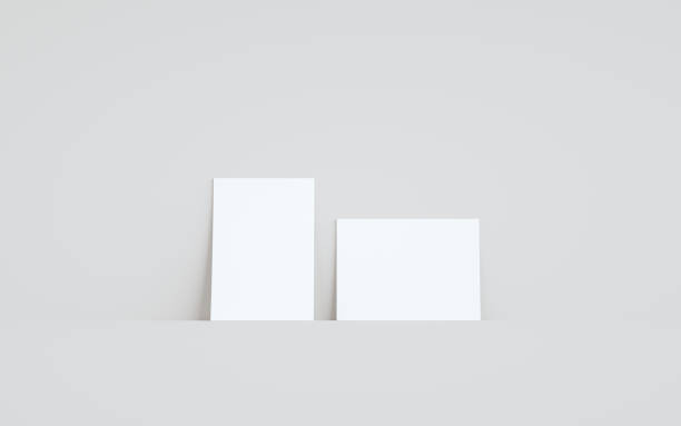istock A6 Flyer / Brochure Mock-Up - Two Flyers Against Wall Background 1312551959