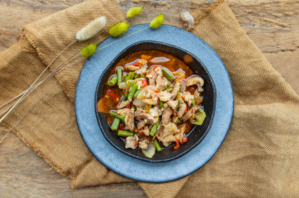 istock Stir fried pork with Roasted red chili paste on Ceramic plate. 1312552203