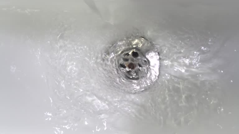 Water down a sink drain