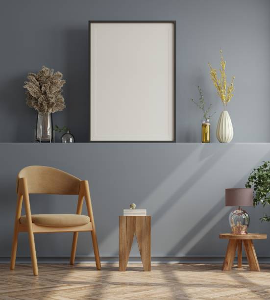 istock Poster mockup with vertical frames on empty dark wall in living room interior with velvet armchair. 1312560388