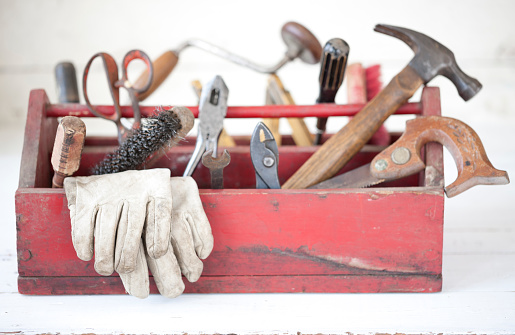 Vintage Work Tools on an old White Wood Background