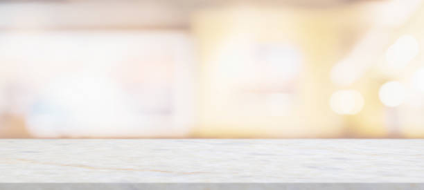 istock marble table top with blurred abstract cafe restaurant interior background 1312563033