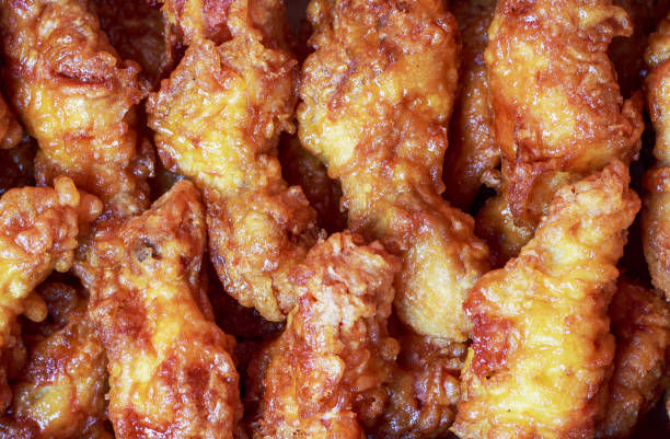 istock Fried crispy chicken legs close-up, top view. 1312563974