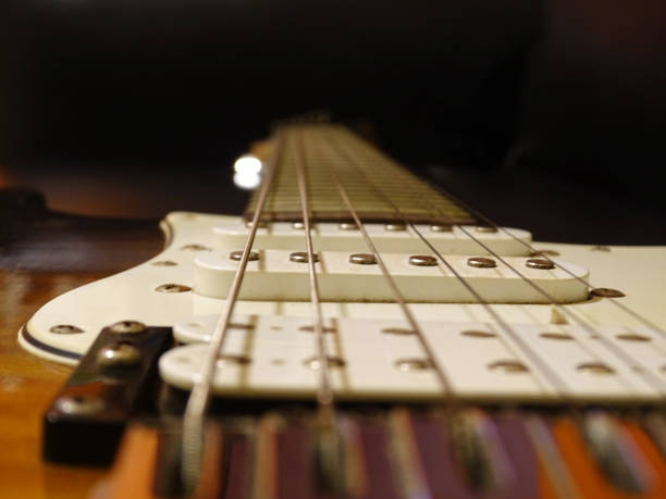 istock Close-up of an electric guitar in a quilted maple pattern 1312564751