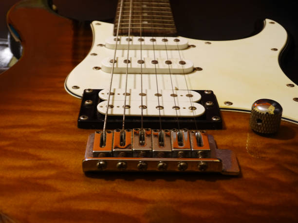 istock Close-up of an electric guitar in a quilted maple pattern 1312564755