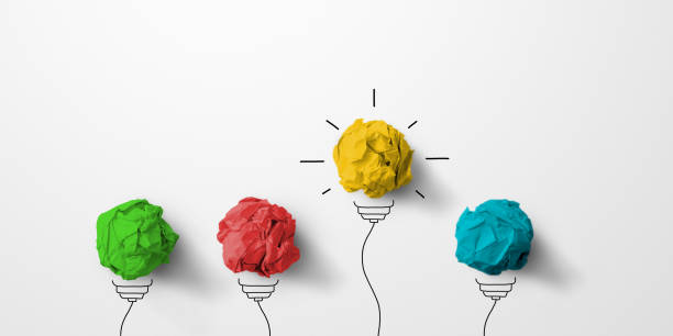 istock Concept creative idea and innovation. Paper scrap ball yellow colour outstanding different group with light bulb symbol 1312566245