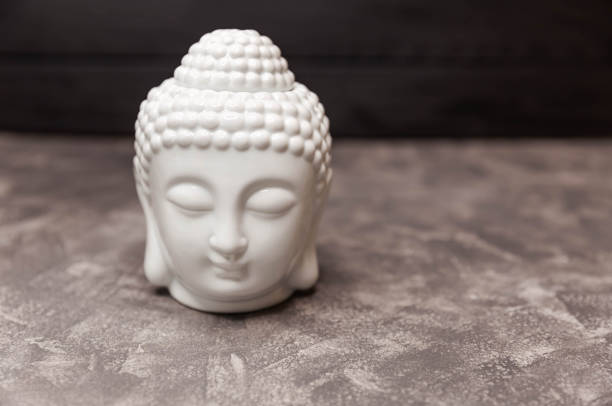 istock Buddha figurine decorative head. Ceramic head of Buddha statue. 1312568663
