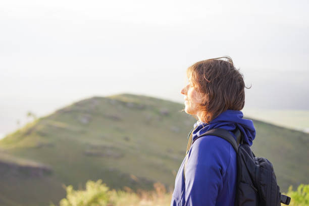 istock Young woman walking in nature 1312572879